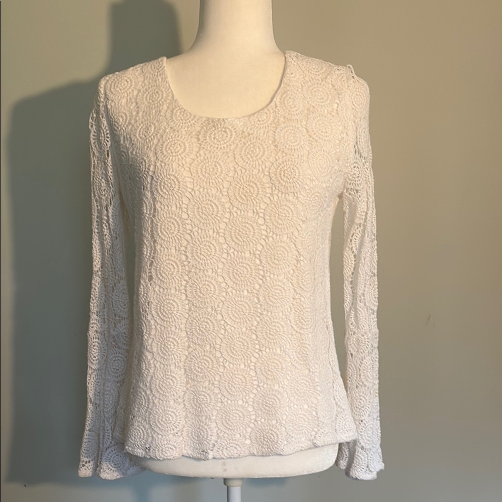 Ladies, elegant, white lace blouse with bell sleeves.